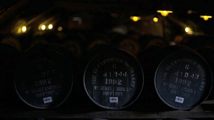 Three whisky casks in a warehouse